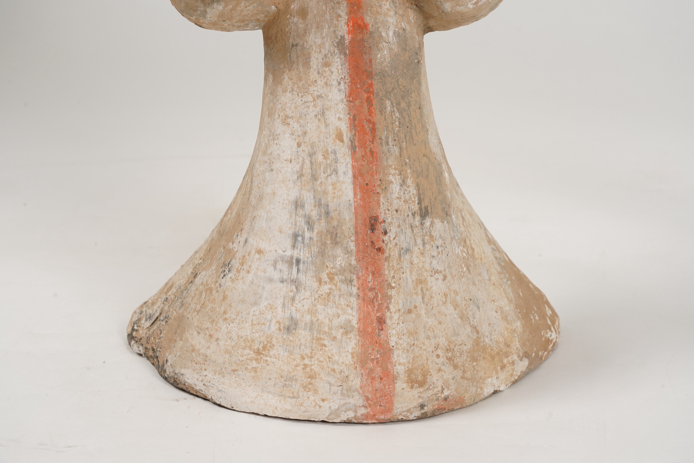 A large Chinese polychrome pottery figure of a female attendant, Han dynasty or later